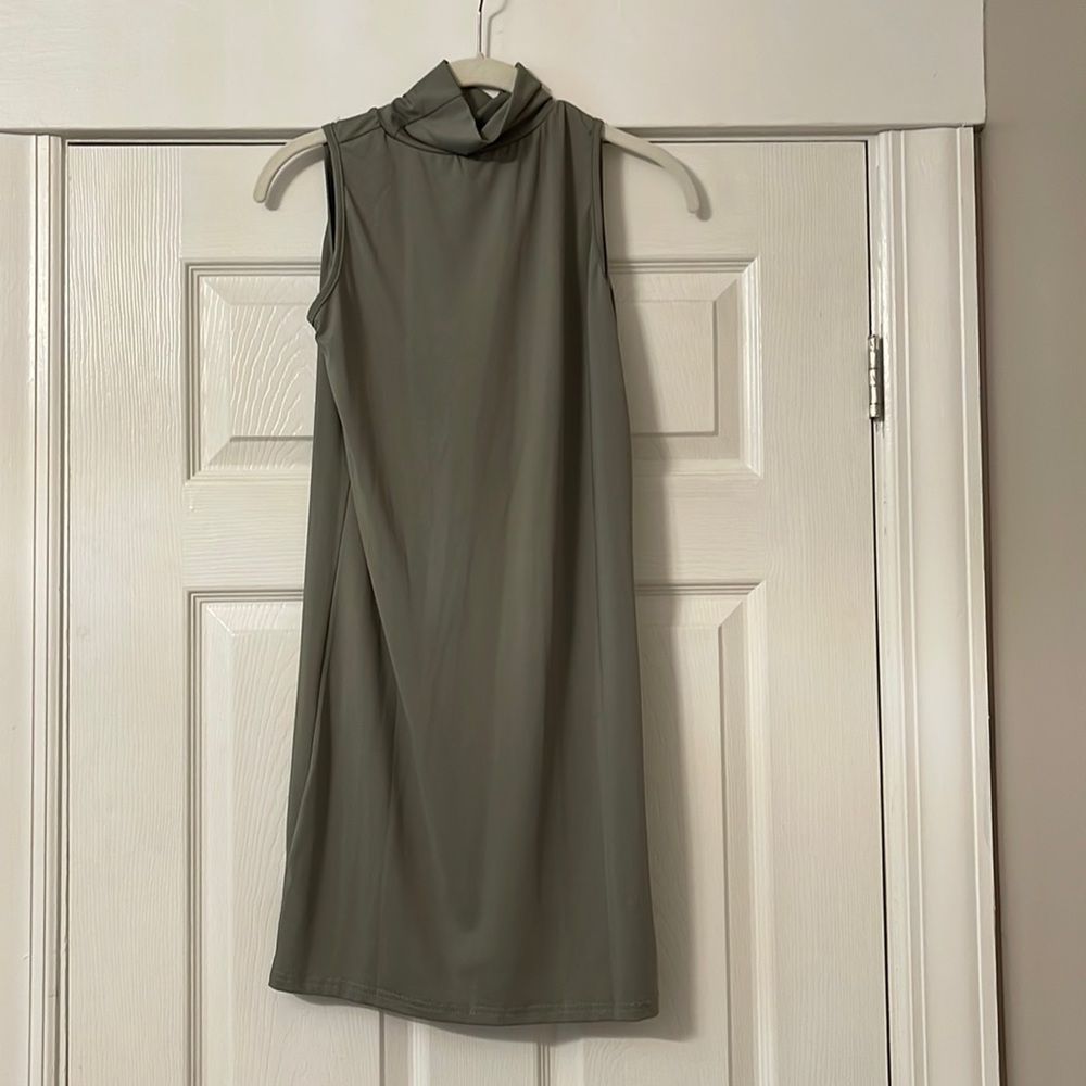 Never worn, spandex green dress with small turtleneck type neck. Size Small
